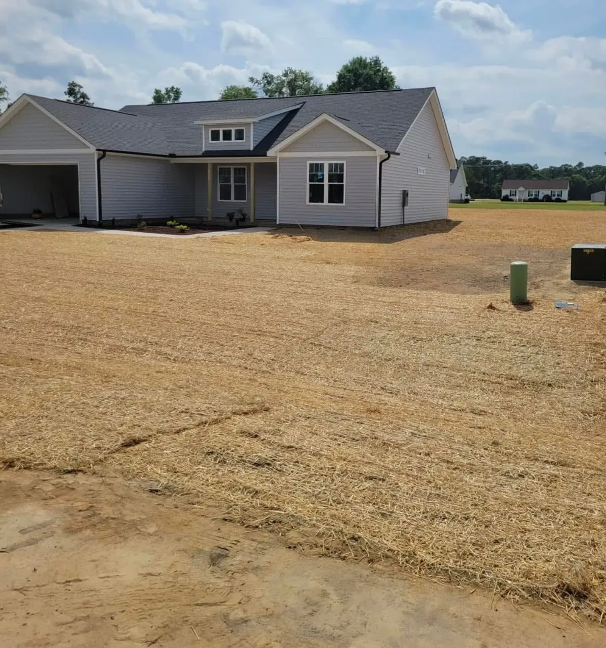 Final grade and straw on a new build